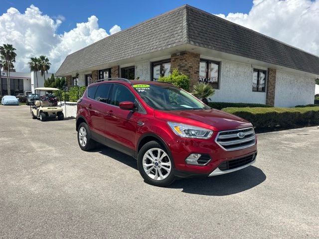 2018 Ford Escape SEL in Ruby Red Metallic — front three-quarter view