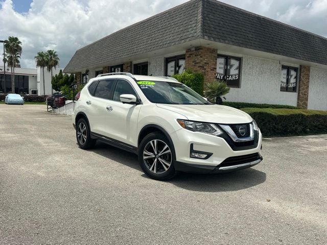 2017 Nissan Rogue SL in Pearl White — front three-quarter view